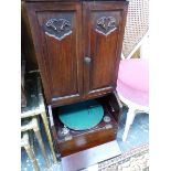 AN UPRIGHT TABLE GRAMOPHONE, POSSIBLY BY PEROPHONE, IN A MAHOGANY MINIATURE BUREAU BOOK CASE STYLE