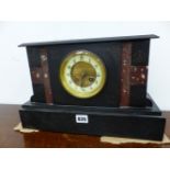 A VICTORIAN BLACK SLATE CASED CLOCK STRIKING ON A COILED ROD