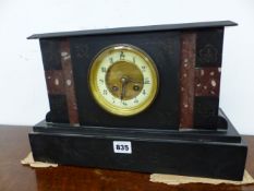 A VICTORIAN BLACK SLATE CASED CLOCK STRIKING ON A COILED ROD