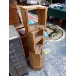 A MODERN RUSTIC SET OF FOUR SHELVES CUT SQUARE FROM TREE TRUNK SECTIONS. H 126cms.