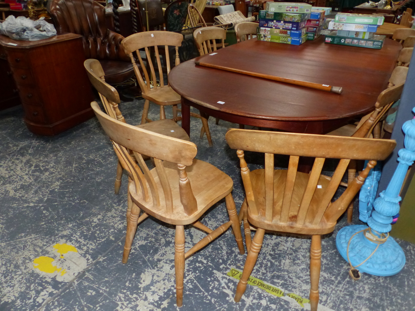 A SET OF ELEVEN PINE KITCHEN CHAIRS
