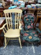 A VICTORIAN MAHOGANY SHOW FRAME ARMCHAIR WITH BUTTON UPHOLSTERED BACK BELOW CARVED FOLIAGE AND