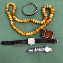 A STRING OF IRREGULAR AMBER BEADS, A MEXICAN SILVER BANGLE, A LADIES AND GENTS LONGINES WATCH, AND A