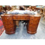 A 20th C. MAHOGANY PEDESTAL DESK THE KNEEHOLE DRAWER FLANKED BY BANKS OF FOUR BOW FRONTED DRAWERS ON
