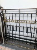 AN EARLY 20th C. BRASS TOPPED IRON DOUBLE BED, TO TAKE A MATTRESS. 182 x 128cms.