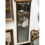 A GROUP OF DECORATIVE GILT AND PAINTED MIRRORS OF VARIOUS SIZES.