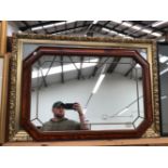 A DECORATIVE OCTAGONAL SHAPED MARGINAL WALL MIRROR, TOGETHER WITH A DECORATIVE GILT FRAMED FISHING