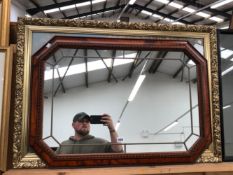 A DECORATIVE OCTAGONAL SHAPED MARGINAL WALL MIRROR, TOGETHER WITH A DECORATIVE GILT FRAMED FISHING