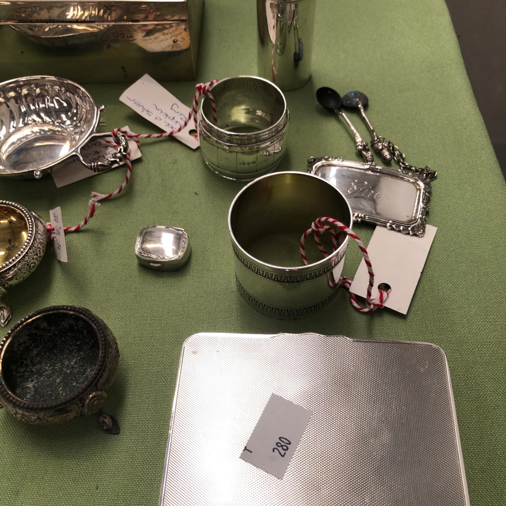 A HALLMAKED SILVER CASE, A SILVER WINE TASTER, NAPKIN RINGS, WINE LABEL, A LARGE SILVER CIGARETTE - Image 4 of 4