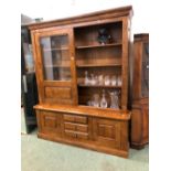 A LARGE BESPOKE GLAZED OAK BOOKCASE WITH SLIDING UPPER DOORS. 211 X 176 X 51cms.