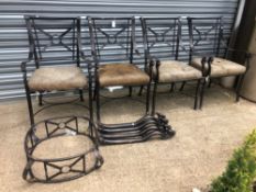 A SET OF FOUR IRON CONSERVATORY/PATIO ARMCHAIRS WITH MATCHING COFFEE TABLE BASE.