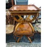 A PAIR OF 20th C. YEW WOOD COFFEE TABLES, THE WAVY GALLERIED TOPS SUPPORTED AT EACH CORNER BY BARS