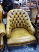 A HOOP BACKED CHAIR BUTTON BACK UPHOLSTERED IN HONEY BROWN LEATHER ABOVE TAPERING CYLINDRICAL