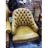 A HOOP BACKED CHAIR BUTTON BACK UPHOLSTERED IN HONEY BROWN LEATHER ABOVE TAPERING CYLINDRICAL