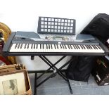A YAMAHA PSR-GX76 ELECTRIC ORGAN ON FOLDING STAND AND WITH CARRYING CASE.