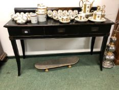 AN ORIENTAL STYLE EBONISED THREE DRAWER SIDE TABLE.