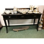 AN ORIENTAL STYLE EBONISED THREE DRAWER SIDE TABLE.