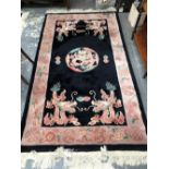 TWO CHINESE RUGS OF DRAGON DESIGN, ONE OVAL. TOGETHER WITH A CIRCULAR RUG. LARGEST 220 x 123cms (3)