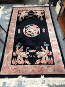 TWO CHINESE RUGS OF DRAGON DESIGN, ONE OVAL. TOGETHER WITH A CIRCULAR RUG. LARGEST 220 x 123cms (3)