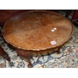A YEW WOOD CIRCULAR COFFEE TABLE, AN OAK TABLE WITH BARLEY TWIST LEGS TOGETHER WITH A BLACK AND GILT