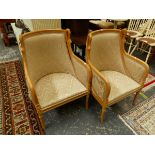A PAIR OF BEECH SHOW FRAME ARMCHAIRS, THE CURVED TOP RAILS FLANKED BY SWANS HEADS
