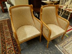 A PAIR OF BEECH SHOW FRAME ARMCHAIRS, THE CURVED TOP RAILS FLANKED BY SWANS HEADS