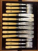 A HALLMARKED SILVER SET OF FISH CUTLERY FOR TWELVE WITH IVORY HANDLES IN MAHOGANY CASE.