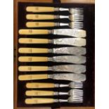 A HALLMARKED SILVER SET OF FISH CUTLERY FOR TWELVE WITH IVORY HANDLES IN MAHOGANY CASE.