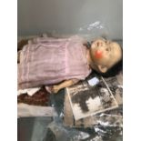 A COMPOSITION HEADED CHINESE DOLL WITH CLOTHING AND TEXTILES