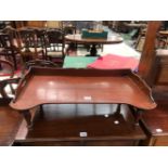 A MAHOGANY WALL UNIT OF A SHELF OVER A CUPBOARD TOGETHER WITH A MAHOGANY TRAY FOR AN INVALIDS BED