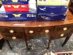 A GEORGE III MAHOGANY BOW FRONT SIDEBOARD, THE CENTRAL DRAWER FLANKED BY TWO ON ONE SIDE AND A