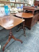 TWO MAHOGANY TRIPOD TABLES, ONE WITH A RECTANGULAR TOP AND THE OTHER OVAL