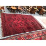 AN AFGHAN SMALL CARPET. 310 x 204cms