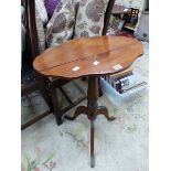 A 19th C. MAHOGANY TILT TOP TRIPOD TABLE WITH A WAVY OVAL TOP. W 55 x D 39 x H 68cms.