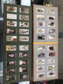 A COLLECTION OF CIGARETTE CARDS IN ALBUMS AND VARIOUS LOOSE SETS.