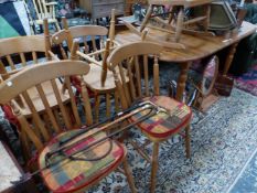 A SET OF SIX PINE KITCHEN CHAIRS, A PAINE ROCKING CHAIR AND A PINE DINING TABLE. W 179 x D 89 x H