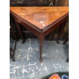A GEORGE III MAHOGANY TRIPLE TOPPED TRIANGULAR TABLE OPENING ON A SINGLE GATE TO FORM A TEA TABLE