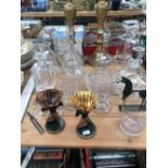 A PAIR OF RUMMERS, DECANTERS, CARAFES, JUGS AND A PAIR OF BRASS CANDLESTICKS.