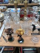 A PAIR OF RUMMERS, DECANTERS, CARAFES, JUGS AND A PAIR OF BRASS CANDLESTICKS.