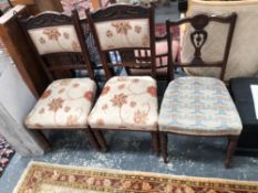 A PAIR OF VICTORIAN OAK CHAIRS TOGETHER ANOTHER CHAIR.