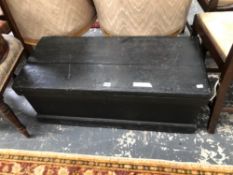 A BLACK PAINTED WOODEN TRUNK. W 94 x D 41 x H 36cms.