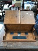 AN EDWARDIAN OAK DESK TOP STATIONARY CABINET / INK STAND