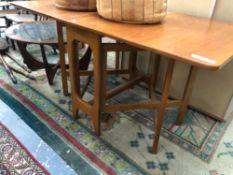 A TEAK DROP LEAF 20th C. DINING TABLE W 144 x H 74 x D 83cms TOGETHER WITH A G-PLAN TYPE GLASS TOP