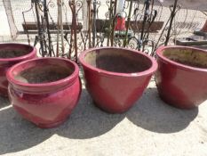 TWO PAIRS OF LARGE RED GLAZED PLANTERS