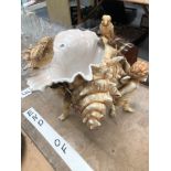 A LARGE PORCELIN SHELL BOWL DECORATED WITH CHERUBS AND BIRDS