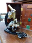 A COOKE, TROUGHTON AND SIMMS MICROSCOPE WITH ADJUSTABLE STAGE.