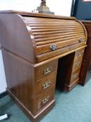 A LATE VICTORIAN WALNUT SMALL ROLL TOP TWIN PEDESTAL DESK, H 98 x W 94 x D 56 cm's