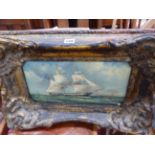 AN OIL PAINTING OF A SAILING SHIP OFF A COAST WITH A LIGHTHOUSE, THE FRAME. 39 x 58cms.