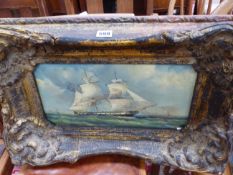 AN OIL PAINTING OF A SAILING SHIP OFF A COAST WITH A LIGHTHOUSE, THE FRAME. 39 x 58cms.