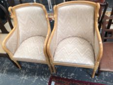 A PAIR OF BEECH SHOW FRAME ARMCHAIRS, THE CURVED TOP RAILS FLANKED BY SWANS HEADS